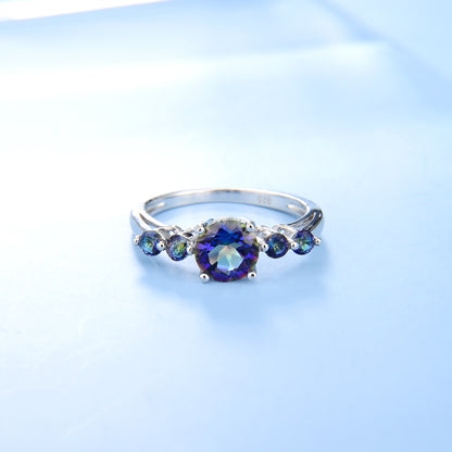 This stunning 925 Sterling Silver Ring is a beautiful showpiece, featuring five round cut Mystic Topaz stones set in a classic style.