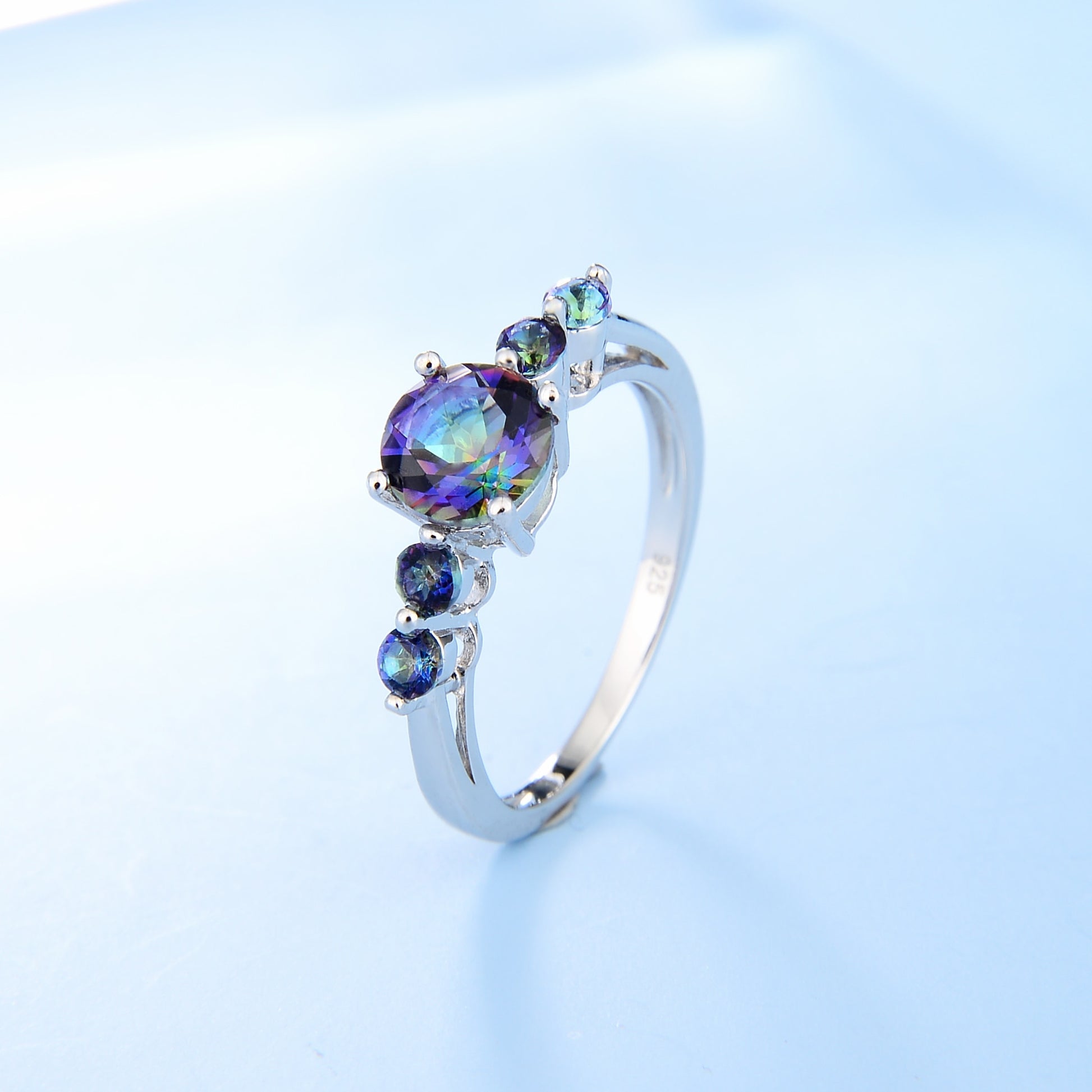 This stunning 925 Sterling Silver Ring is a beautiful showpiece, featuring five round cut Mystic Topaz stones set in a classic style.