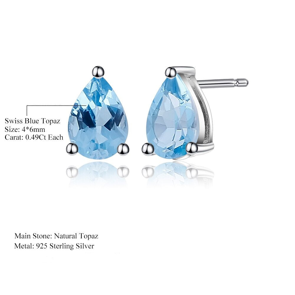 These stunning Art Deco earrings feature pear-shaped Swiss Blue Topaz gems, set perfectly in 925 Sterling Silver.