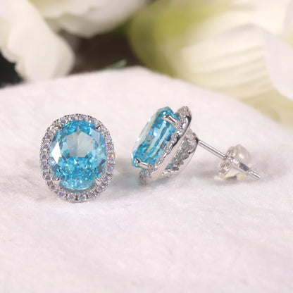 Choosen Jewelry: 925 Sterling Silver Aqua Blue Halo Stud Earrings with Oval Diamond-fire CZ