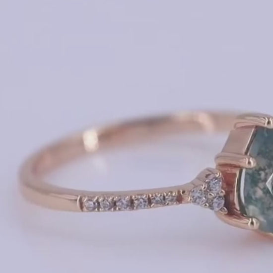 This unique Pear Shaped Moss Agate Engagement Ring is truly a one-of-a-kind piece of art.